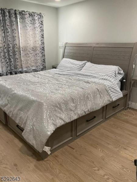 bedroom featuring light wood-type flooring