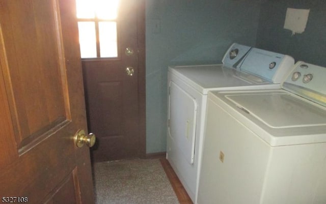 washroom with washing machine and clothes dryer