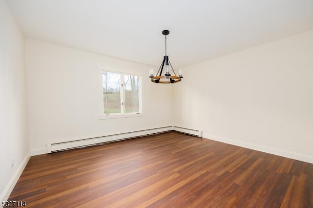 unfurnished dining area featuring dark hardwood / wood-style floors, baseboard heating, and an inviting chandelier