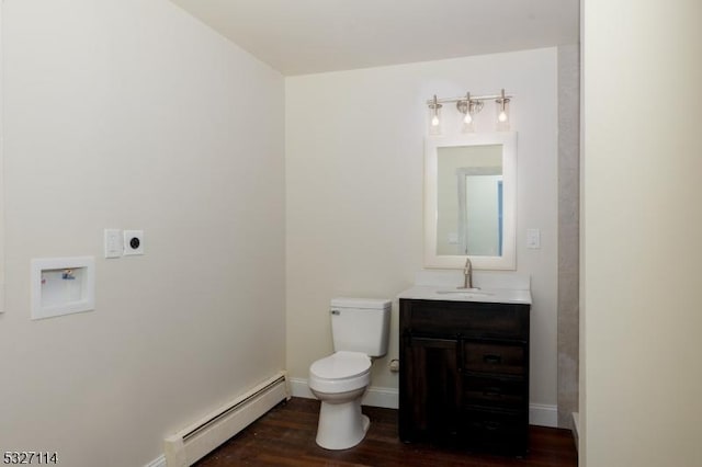 bathroom featuring toilet, vanity, a baseboard radiator, and wood-type flooring