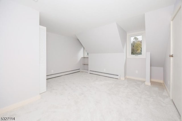 bonus room featuring baseboard heating, light carpet, and lofted ceiling