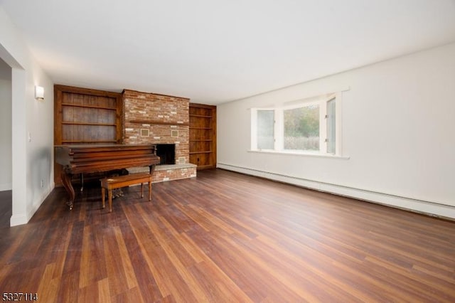 living room featuring a fireplace, dark hardwood / wood-style floors, and baseboard heating