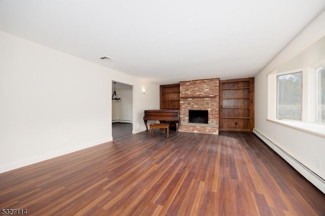 unfurnished living room featuring baseboard heating, a fireplace, and dark wood-type flooring