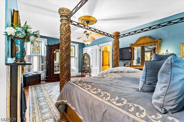 bedroom with wood-type flooring and ceiling fan