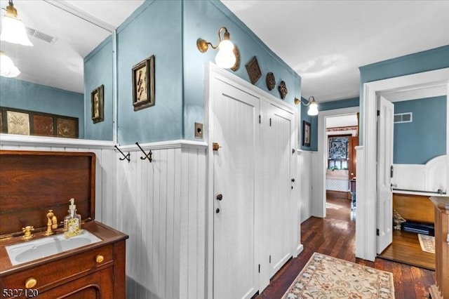 bathroom with hardwood / wood-style floors and vanity