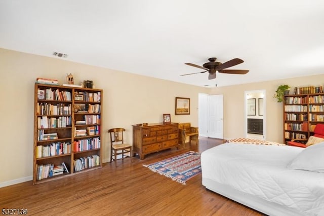 bedroom with wood-type flooring