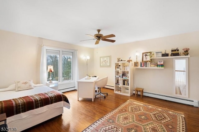 bedroom with a baseboard radiator and wood-type flooring