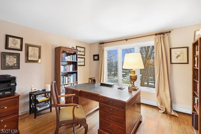 office with a baseboard radiator and light hardwood / wood-style flooring