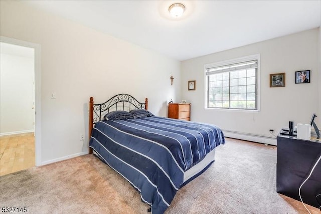 bedroom with carpet and a baseboard radiator