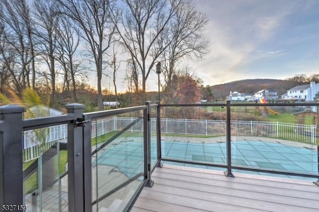 deck at dusk with a mountain view