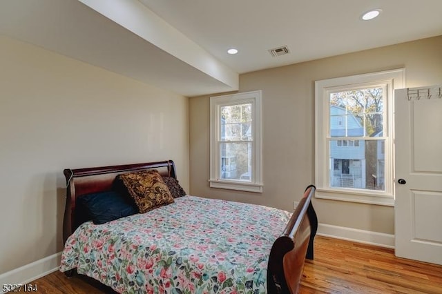 bedroom with hardwood / wood-style flooring