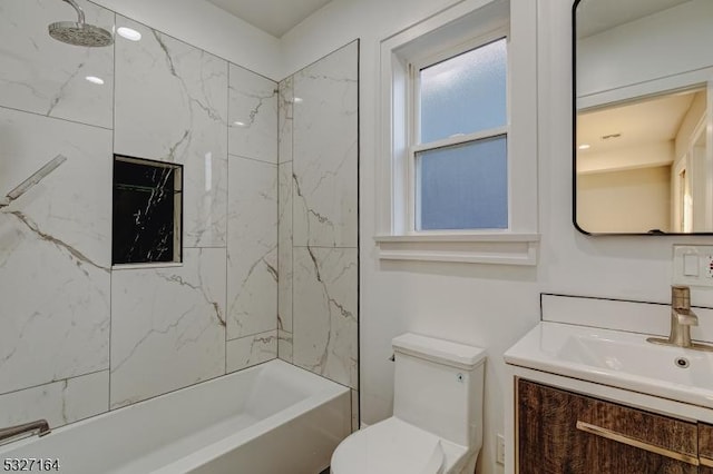 full bathroom with vanity, toilet, and tiled shower / bath combo