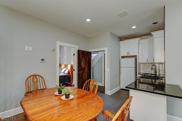 dining room featuring sink