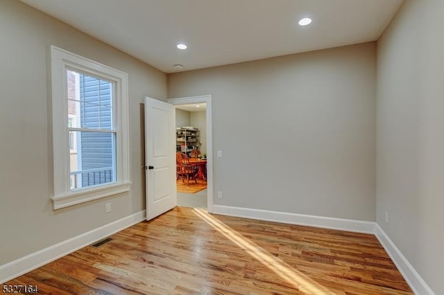 spare room featuring light wood-type flooring