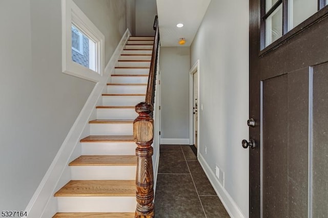 stairway featuring tile patterned flooring