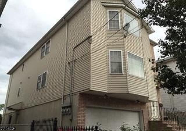 view of side of property with a garage