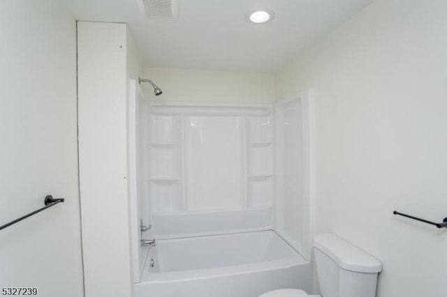 bathroom featuring toilet and shower / washtub combination