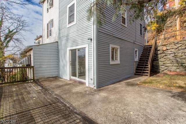 view of side of property with a patio area