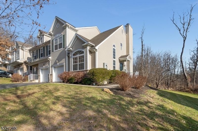 view of property exterior featuring a yard and a garage