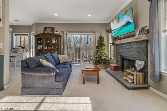 living room featuring carpet floors, a wealth of natural light, and ornamental molding