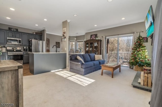 living room with light carpet and crown molding