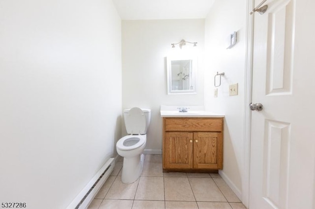 bathroom with tile patterned floors, vanity, and toilet