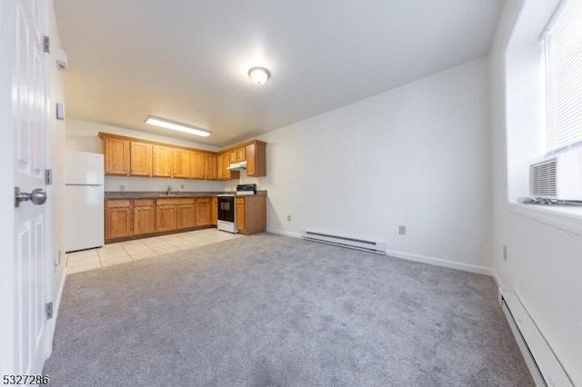 kitchen featuring white appliances, baseboard heating, and light carpet