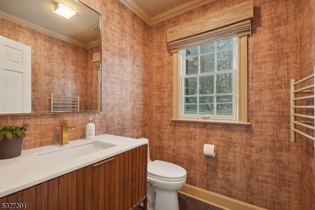 bathroom with radiator heating unit, vanity, toilet, and ornamental molding