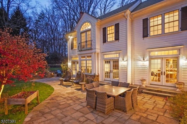 back of house featuring french doors and a patio