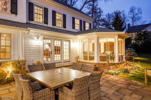 view of patio featuring a sunroom and french doors