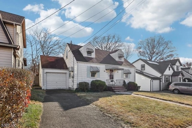 new england style home with a garage and a front lawn