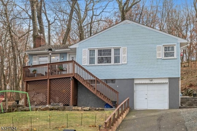 exterior space featuring a front lawn and a garage