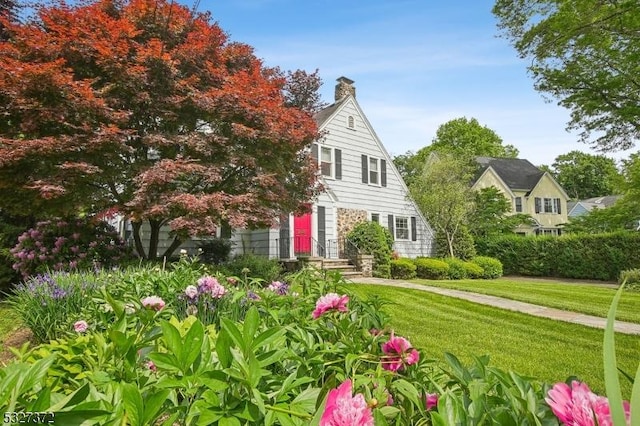 view of front of home with a front yard