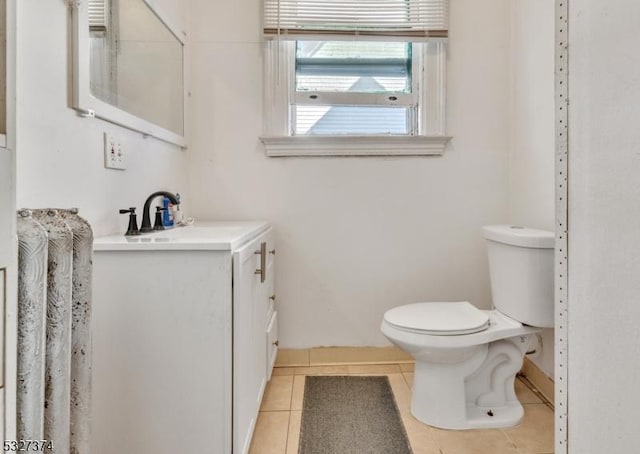 bathroom with tile patterned floors, vanity, and toilet