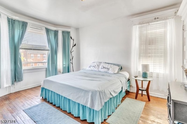 bedroom with light hardwood / wood-style floors