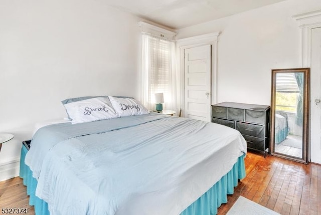 bedroom featuring wood-type flooring