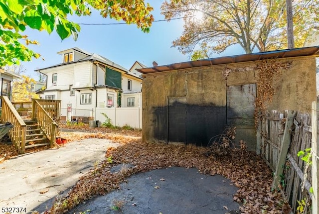 view of side of property featuring a wooden deck