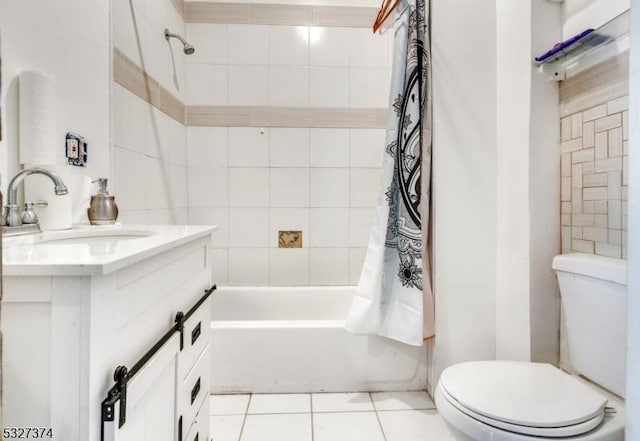 full bathroom featuring tile patterned flooring, vanity, toilet, and shower / bath combo with shower curtain