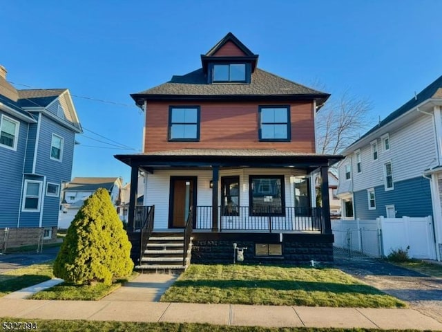 view of front of house featuring a front lawn and a porch