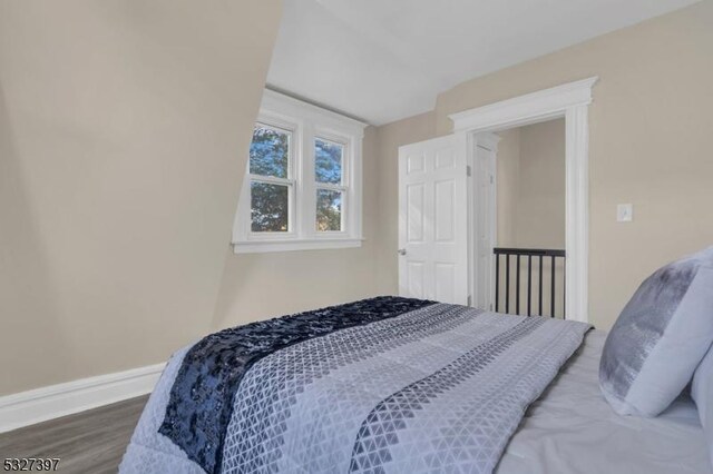 bedroom with hardwood / wood-style floors