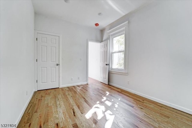 unfurnished bedroom featuring light wood-type flooring