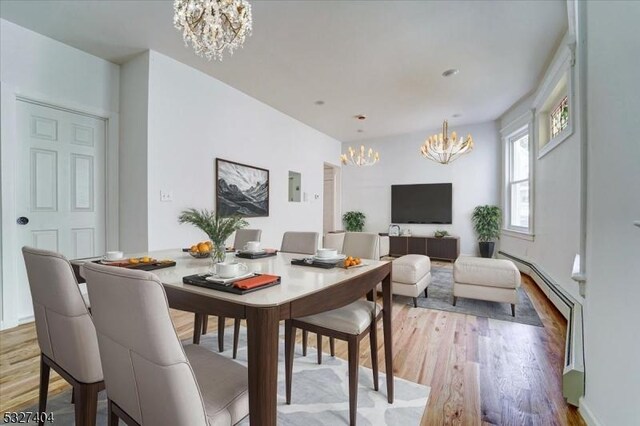 dining area featuring wood-type flooring