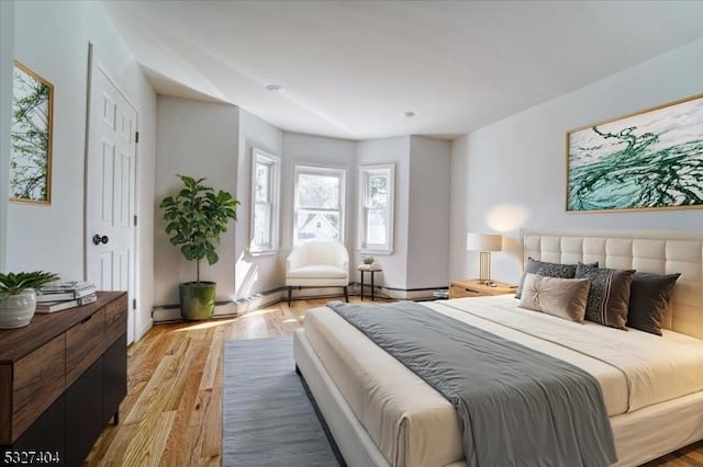 bedroom with light hardwood / wood-style floors