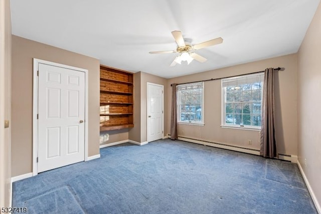 unfurnished bedroom featuring ceiling fan, dark carpet, and baseboard heating