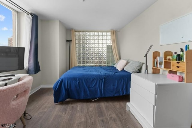 bedroom featuring dark hardwood / wood-style flooring