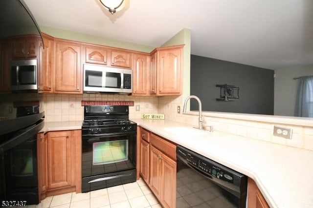 kitchen featuring decorative backsplash, kitchen peninsula, sink, black appliances, and light tile patterned flooring