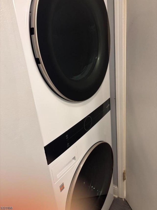 laundry area with stacked washer / dryer