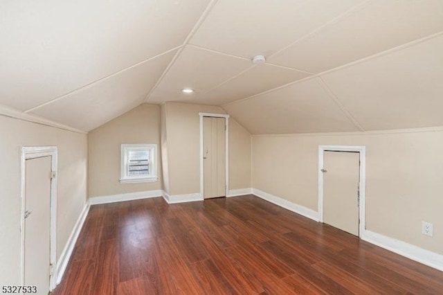 bonus room with dark hardwood / wood-style flooring and lofted ceiling