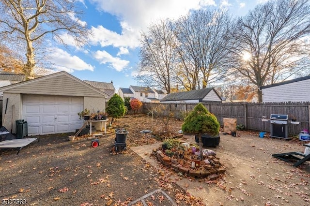 view of yard with a garage and an outdoor structure