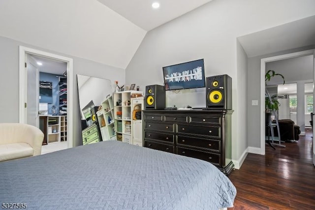 bedroom with dark hardwood / wood-style flooring and lofted ceiling